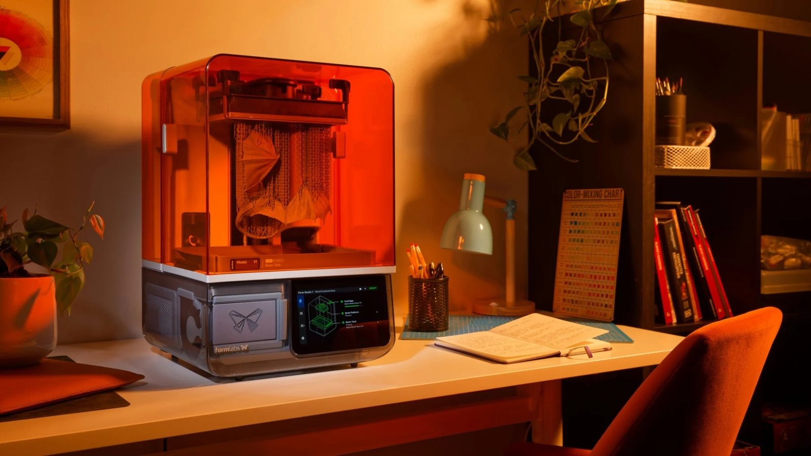 Formlabs Form Studio 1 resin 3D printer on a desk in a home studio