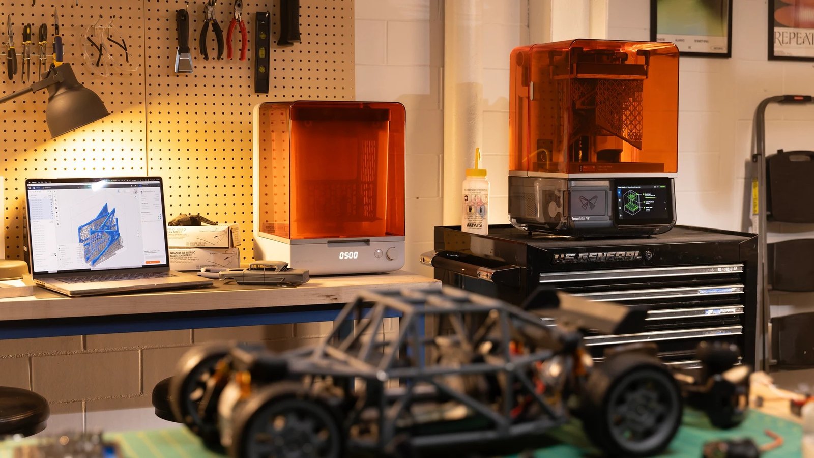 Formlabs Form Studio 1 in a maker workshop next to a 3D printed RC car
